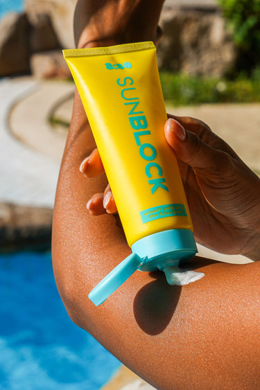 Applying 8:50 Sunblock by the pool