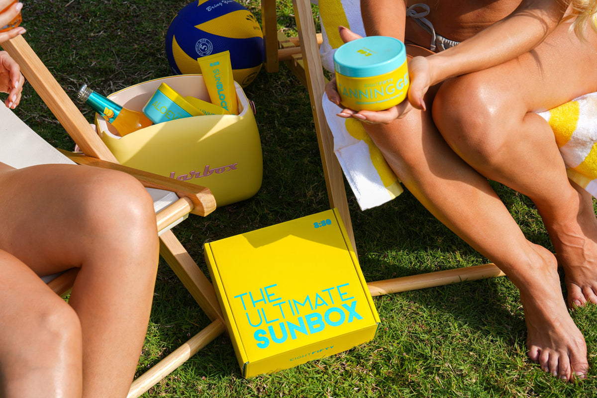 The Ultimate Sun Box on the grass between sun loungers